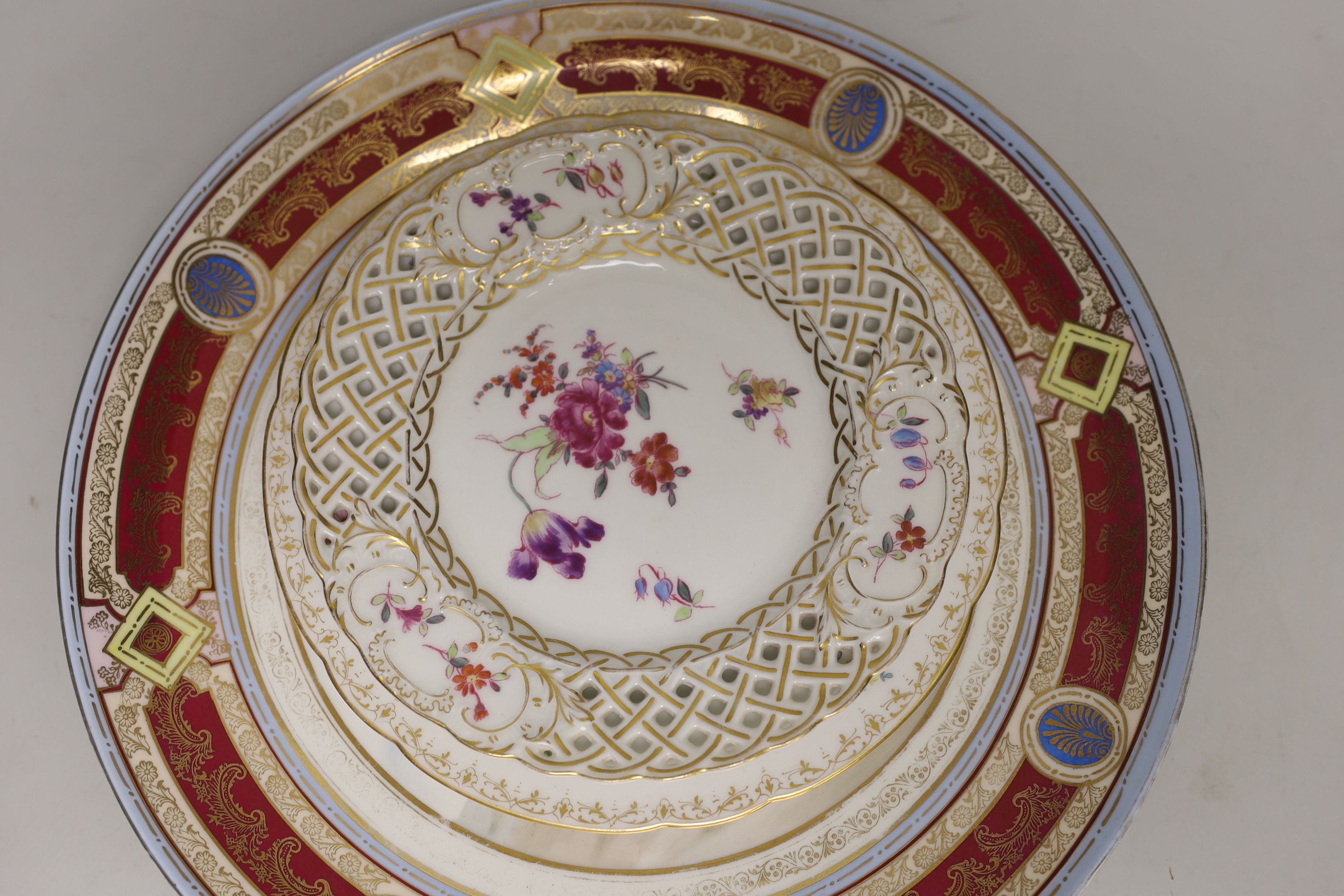 Six Continental porcelain items, including a Sevres style lidded box, a ‘Meissen’ plate with pierced rim, a Dresden plate, etc. largest 31.5cm